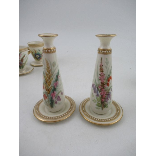 415 - Four Royal Worcester vases, decorated with hand painted flowers and having jewelled decoration, heig... 