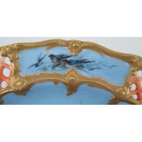 418 - A Royal Worcester comport, decorated with five swans to a blue ground by CHC Baldwyn, the border wit... 