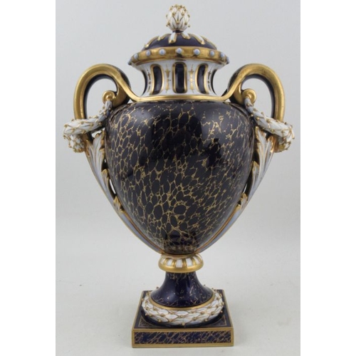 424 - A Royal Worcester ornate two handled covered pedestal vase, decorated to the front with two seated g... 