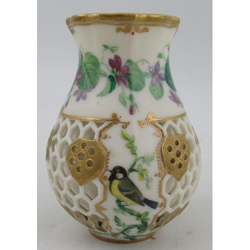 429 - A Kerr & Binns Worcester reticulated jug, decorated with painted flowers and a bird, height 4ins