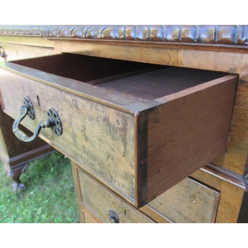 44 - A Georgian design walnut writing desk fitted with three frieze drawers over two pedestal, of three d... 