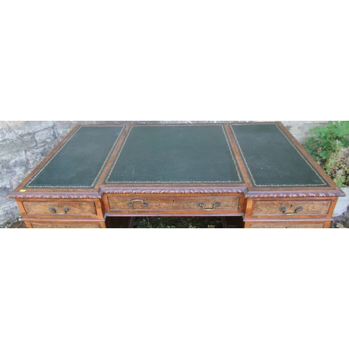 44 - A Georgian design walnut writing desk fitted with three frieze drawers over two pedestal, of three d... 