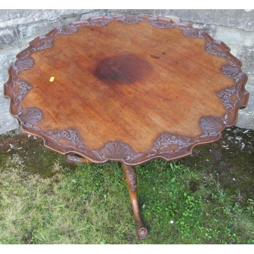 45 - A Georgian design mahogany supper table, with floral carved top and leaves to a cabriole base, 34.5i... 