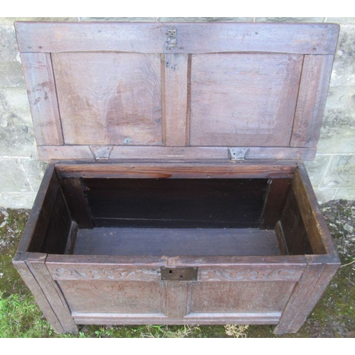 47 - A small 18th century oak coffer, with plain raising lid and floral frieze  (133)