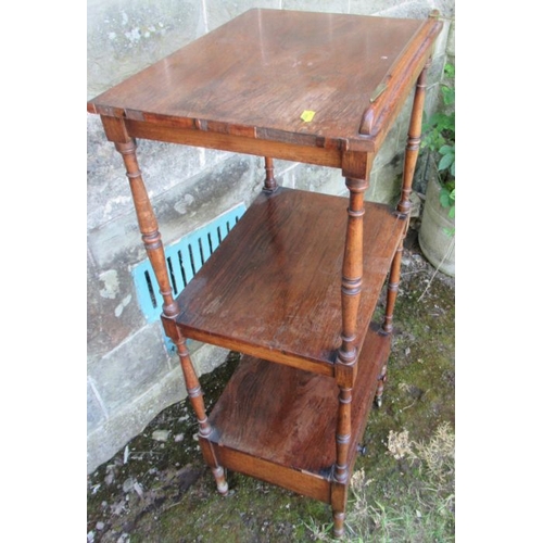 49 - A 19th century rosewood what not having three tiers, the upper section with a ratcheted slope and fi... 