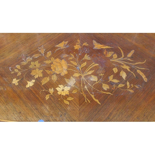 54 - A 19th century quarter veneered fold over mahogany games table, with inlaid floral decoration, raise... 