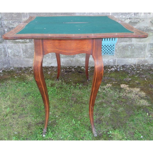 54 - A 19th century quarter veneered fold over mahogany games table, with inlaid floral decoration, raise... 