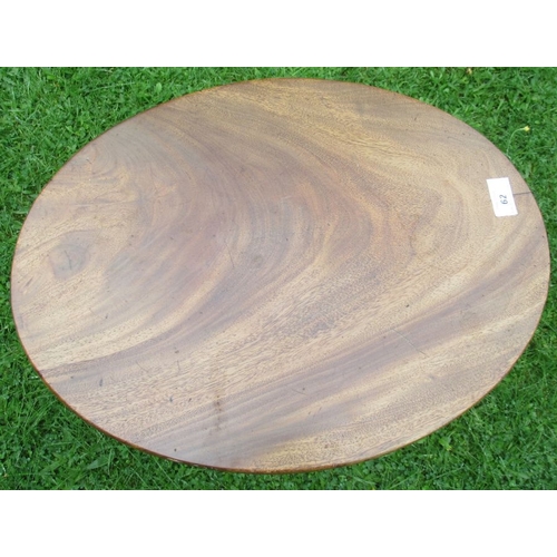 62 - A mahogany oval top tripod table, 14.5ins x 19ins, height 27ins