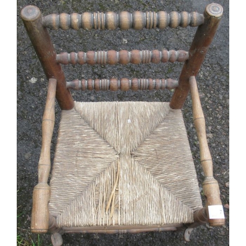 7 - A child's high chair or correction chair, with bobbin turning and wicker seat