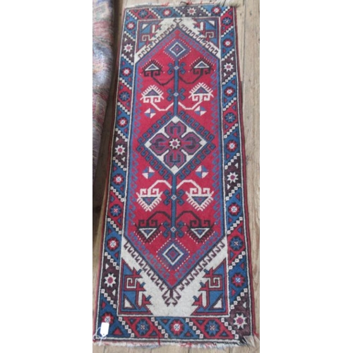 72 - An Eastern design rug, the red ground field having purple ground lozenges, 85ins x 50ins, together w... 