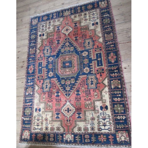 74 - An Eastern design rug, the field decorated with various symbols, 80ins x 54ins