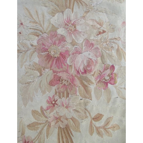 76 - An Aubusson style wall hanging, decorated with flowers, 107ins x 50.5ins