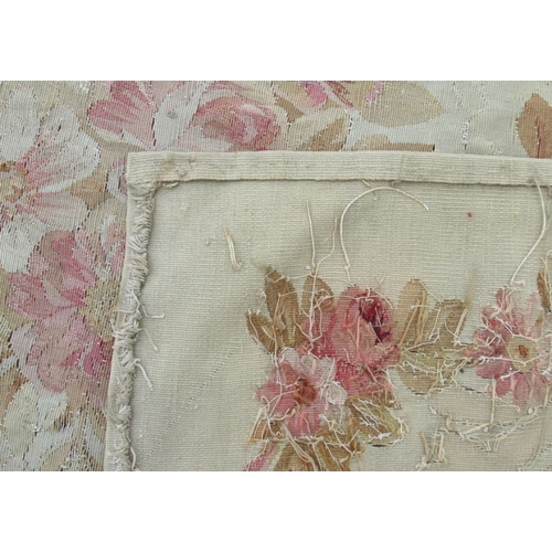 76 - An Aubusson style wall hanging, decorated with flowers, 107ins x 50.5ins