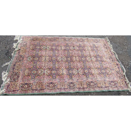 77 - A highly patterned Eastern design rug, 108ins x 74ins