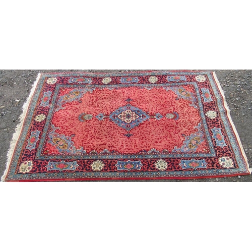 78 - An Eastern design rug, with red field and blue ground lozenges, 87ins x 54ins