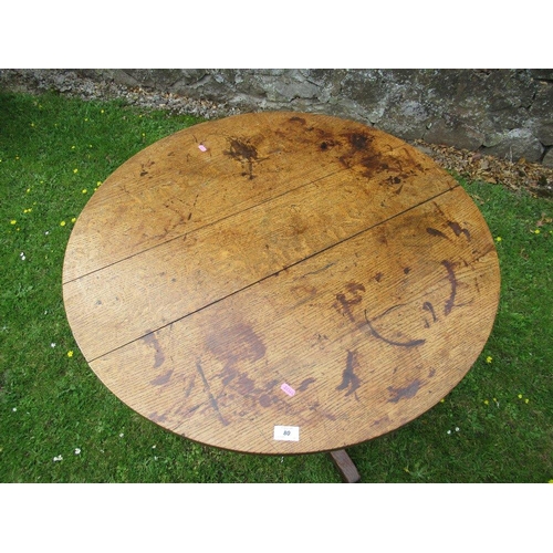 20 - An oak tripod table diameter 35ins height 28ins