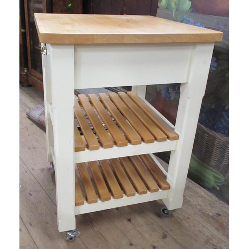 27 - A modern pine topped and painted kitchen trolley, on wheels, fitted with a drawer over shelves, 23.5... 