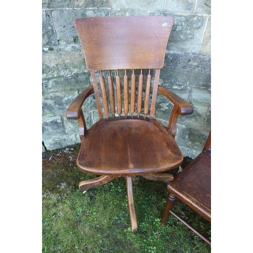 10 - An Oak captain chair, together with a chair with a trouser press