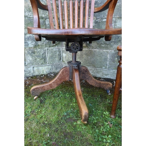 10 - An Oak captain chair, together with a chair with a trouser press