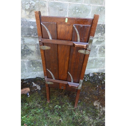 10 - An Oak captain chair, together with a chair with a trouser press