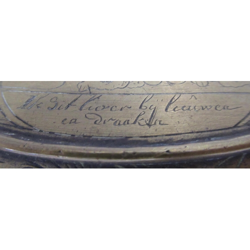 103 - An Antique oval brass snuff box, with engraved decoration, maximum diameter 5ins, height 12.75ins