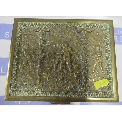 104 - A brass box, with embossed cherub and scroll decoration, 7.75ins x 6ins, height 3ins