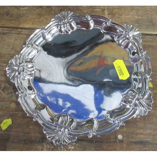 116 - A silver card tray, with shaped ogee and shell edge, diameter 6.5ins, weight 4oz