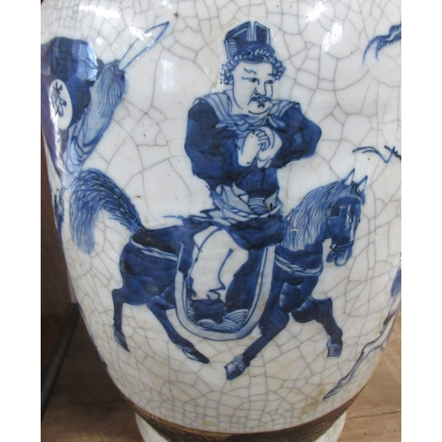 118 - A Chinese vase, decorated in blue and white with warriors, af, height 18ins