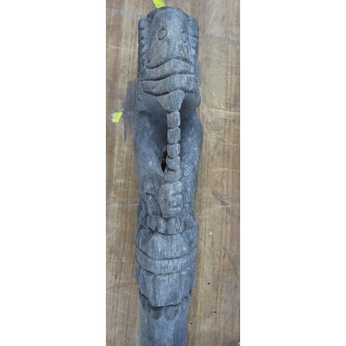 131 - A carved wooden walking stick, with elephant pommel, length 31ins