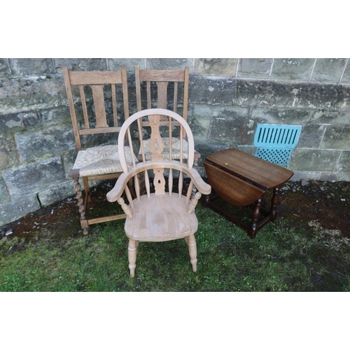 14 - A child's Windsor arm chair together with two cane seated chairs and an occasional table