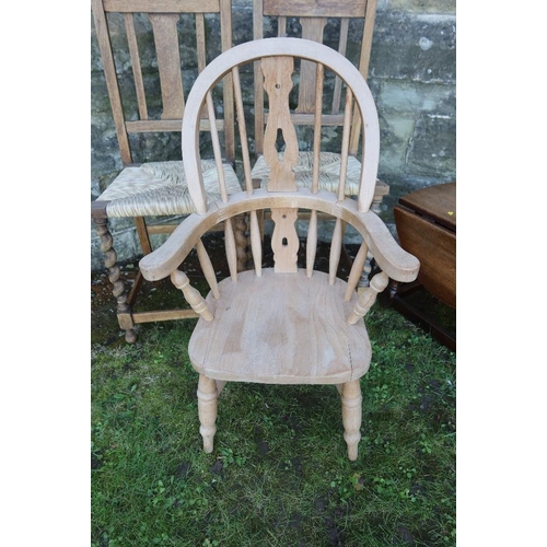 14 - A child's Windsor arm chair together with two cane seated chairs and an occasional table