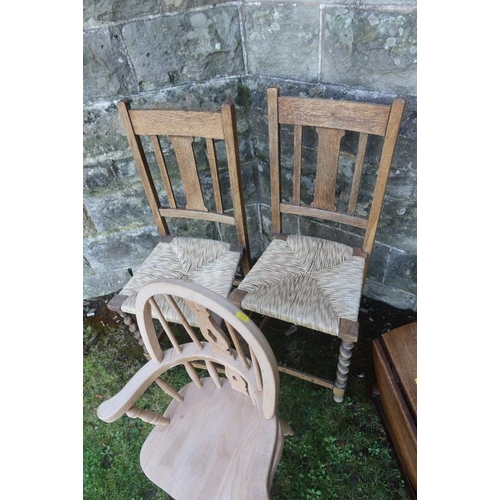 14 - A child's Windsor arm chair together with two cane seated chairs and an occasional table