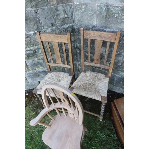 14 - A child's Windsor arm chair together with two cane seated chairs and an occasional table