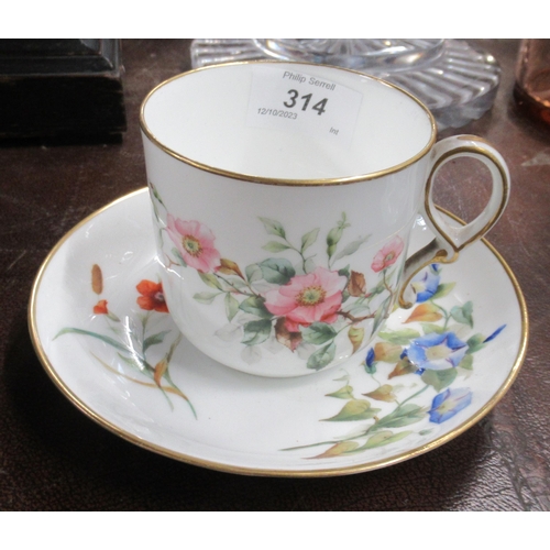 141 - A Royal Worcester cup and saucer decorated with flowers