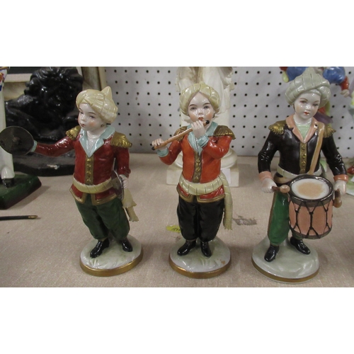 147 - A Sitzendorf porcelain six piece band, with figures plating musical instruments, height 6ins