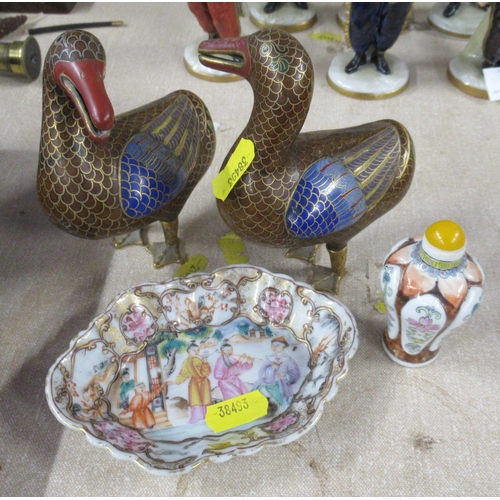 148 - A pair of cloisonne models of ducks, together with an Oriental dish and a scent bottle