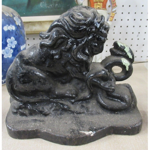 150 - A painted cast iron door stop, of a lion and serpent, height 6.25ins