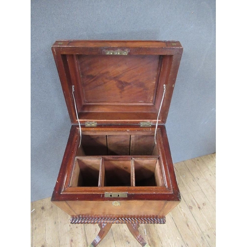 16 - A Regency mahogany cellarette / teaboy, the top opening to reveal compartments raised on turned colu... 