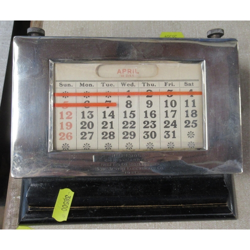 165 - A desk calendar, with silver frame