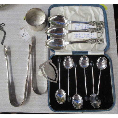 166 - A cased set of silver coffee bean spoons, together with other flatware