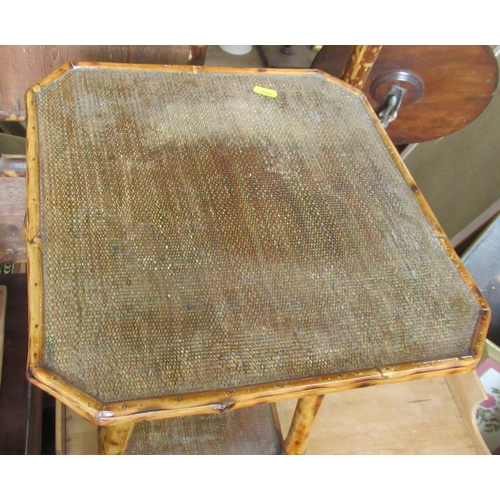 17 - A bamboo octagonal display table, together with another bamboo occasional table