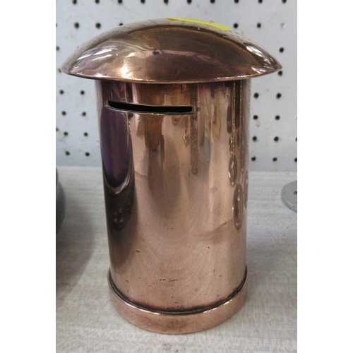 173 - A copper money box, formed as a post box, height 5ins