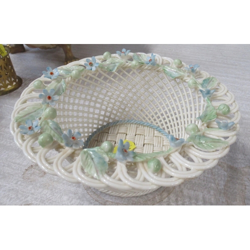 177 - A Belleek porcelain basket weave bowl, decorated with coloured flowers, diameter 6ins, height 2.5ins