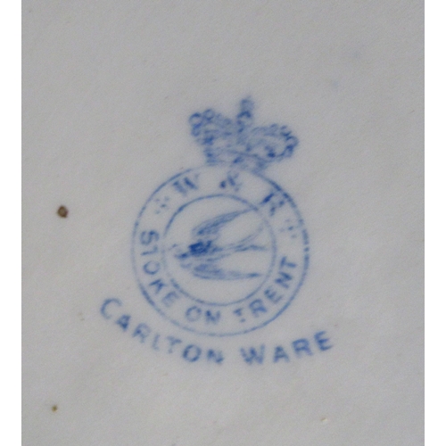 192 - A collection of items to include a Carlton ware salad bowl, servers, knife rests etc