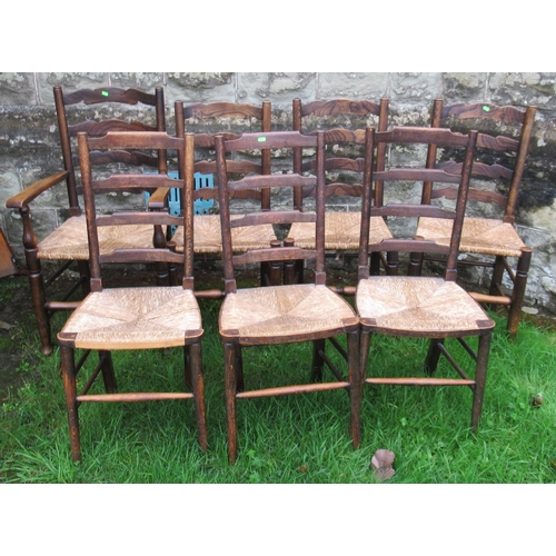 2A - A set of four (3+1) oak ladder back chairs, with rush seats, together with another set of three