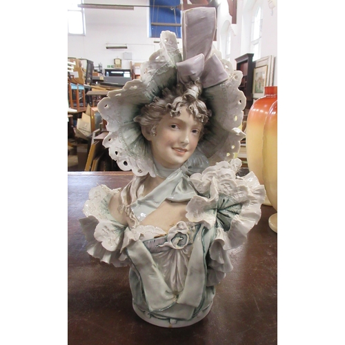 210 - A Royal Dux porcelain bust, of a woman wearing a bonnet, height 16ins