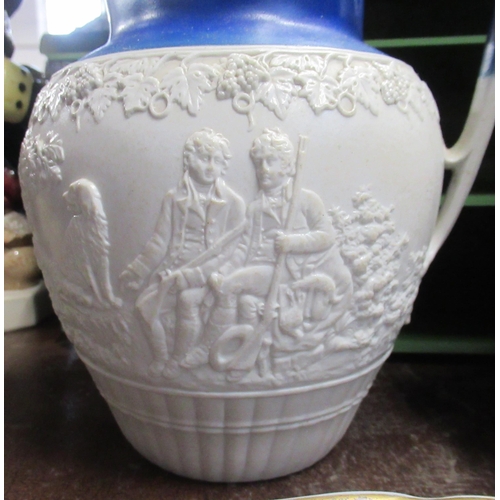 219 - A 19th century Turner stoneware jug, decorated with an Archery scene, height 8.5ins, together with a... 