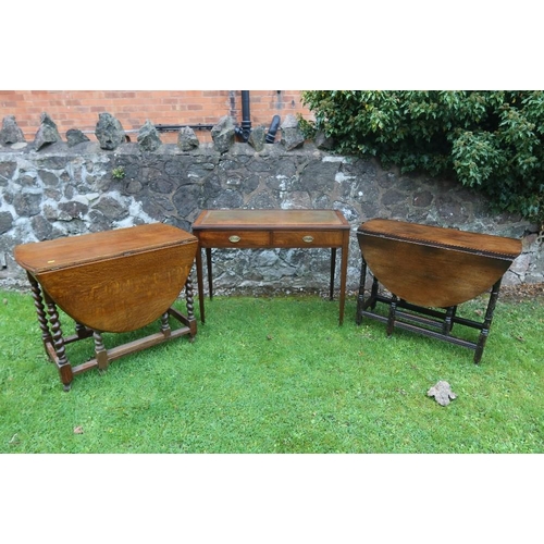 22 - A mahogany writing table, width 40ins, depth 18ins, height 30ins, together with 2 oak gate leg table... 