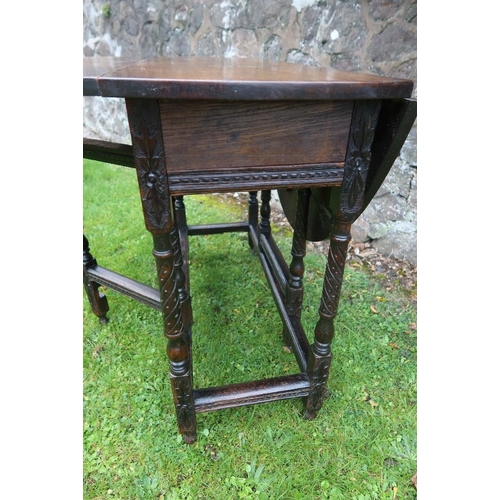 22 - A mahogany writing table, width 40ins, depth 18ins, height 30ins, together with 2 oak gate leg table... 