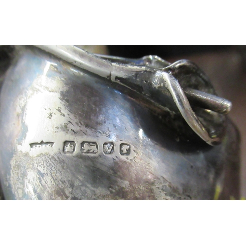 233 - A silver milk jug, and sugar bowl, with shaped edge and flower handles, weight 7oz